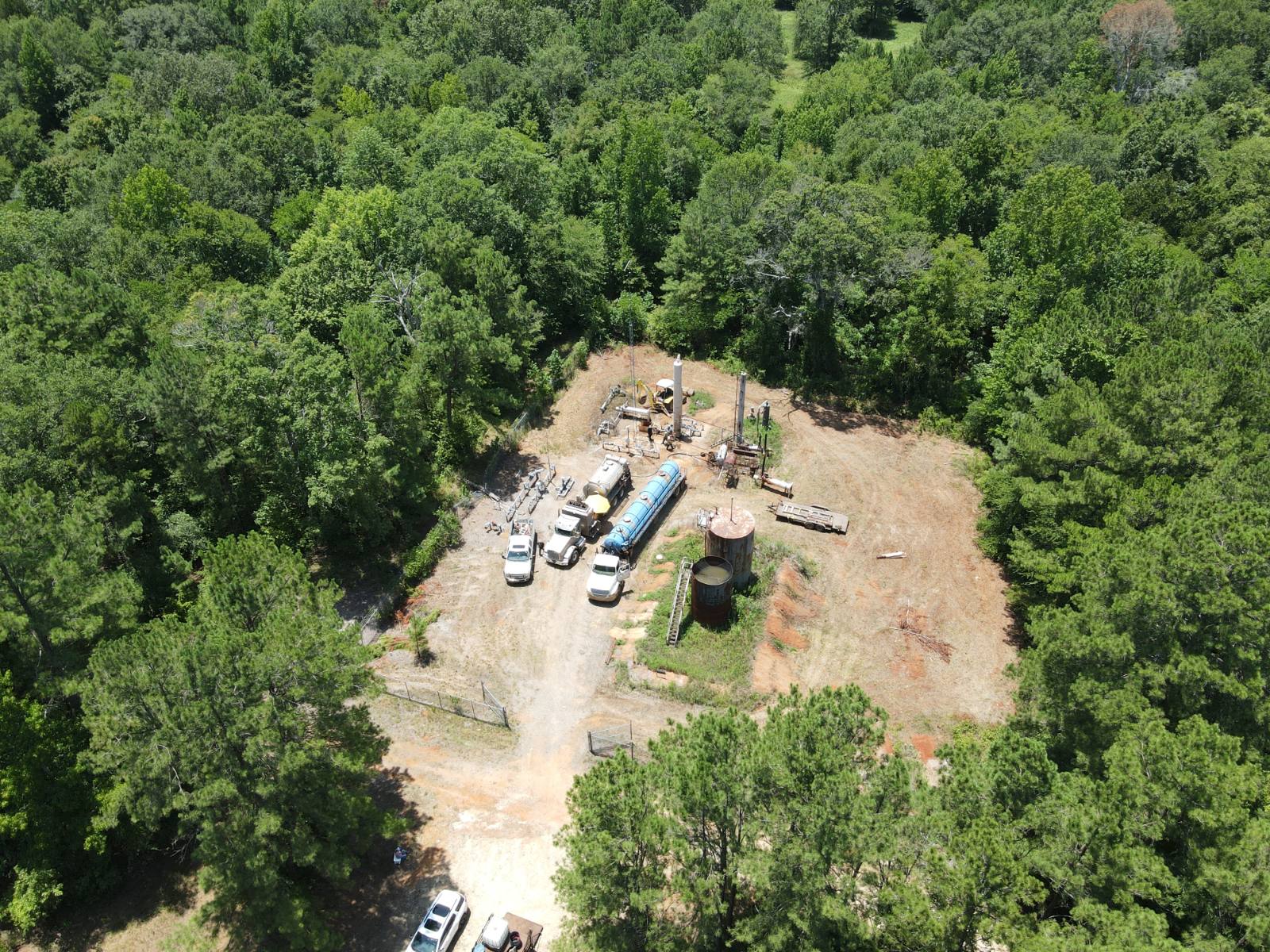 Overhead drone view of a Norwood Energy well site with service trucks and crew on location